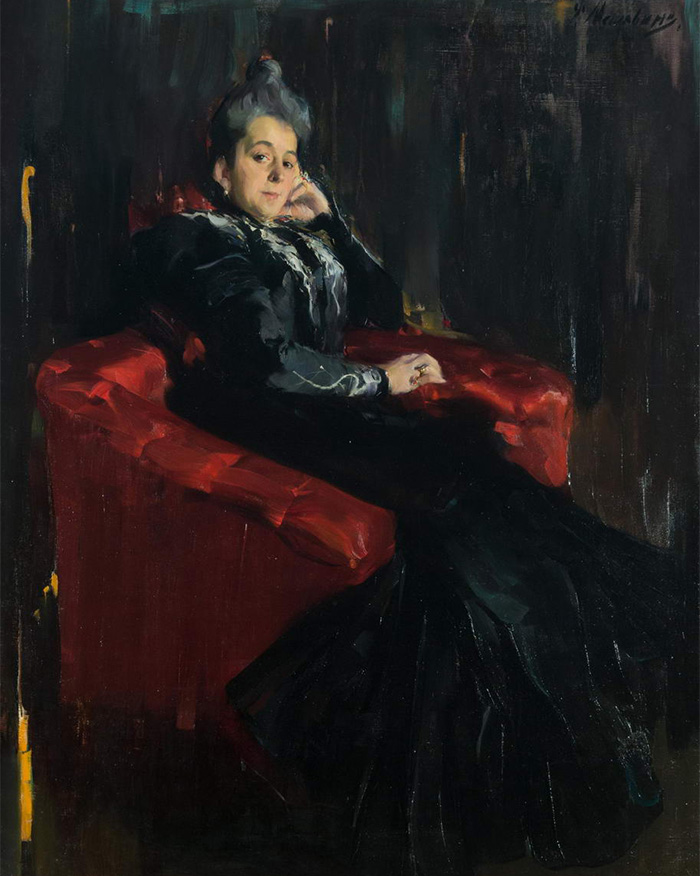 A woman in a black dress seated on a red armchair, depicting the terrifying human mind in criminal cases.