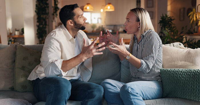 A man and woman arguing on a couch, representing issues surrounding baby's dad and childcare. A man and woman arguing on a couch, representing issues surrounding baby's dad and childcare.