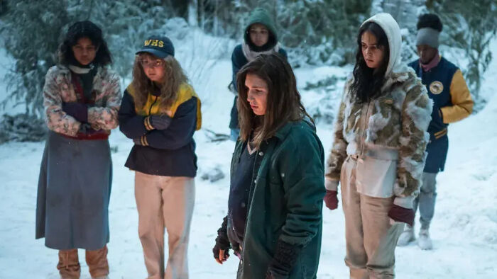 A group of women in a survival scene, critiquing Hollywood's flawless look obsession. A group of women in a survival scene, critiquing Hollywood's flawless look obsession.