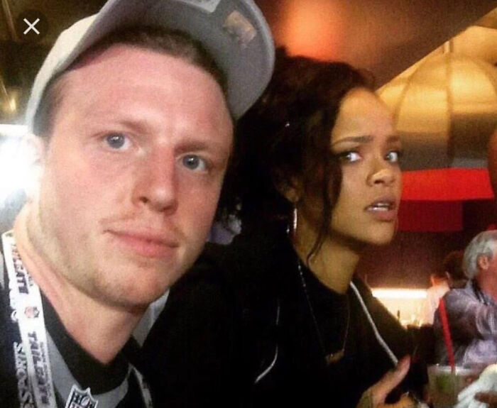 A fan takes a selfie with Rihanna, who looks surprised, illustrating moments people asked celebrities for a photo.