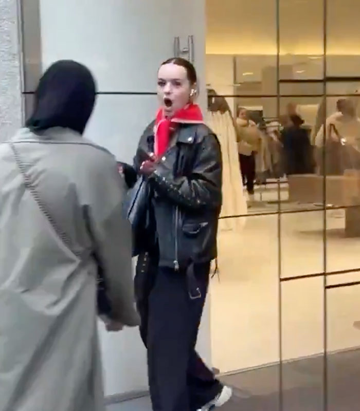 A daughter reacts with surprise as her family flies across the world to surprise her, capturing her reaction.