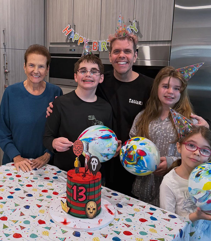 Perez Hilton and family celebrate a birthday with a horror-themed cake, showing a disturbing livestream secret.