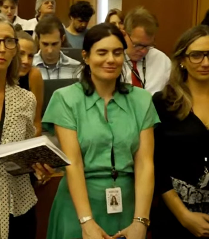 A woman in a green dress lady in the Lindsay Clancy trial courtroom, identified after a viral video backlash. A woman in a green dress lady in the Lindsay Clancy trial courtroom, identified after a viral video backlash.