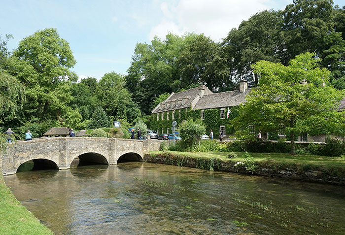 An ancient bridge over a river in the world's most beautiful village, a popular spot for tourists. An ancient bridge over a river in the world's most beautiful village, a popular spot for tourists.