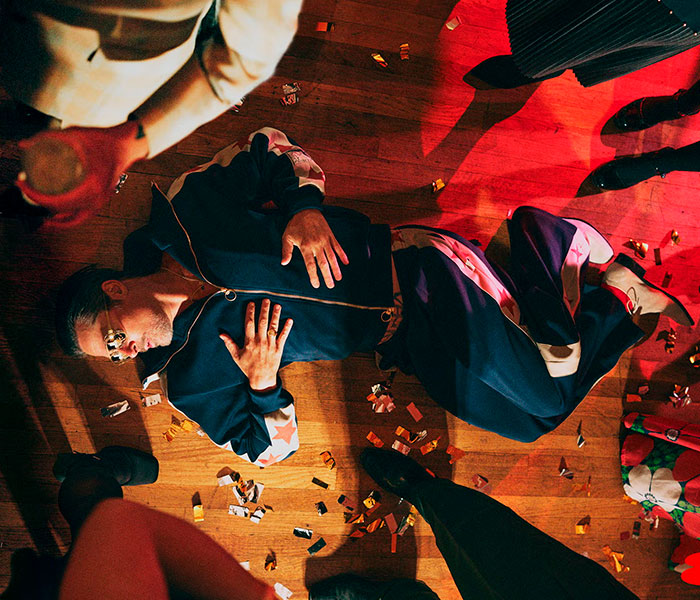 Brad Pitt on the floor at a party, surrounded by confetti, highlighting his sobriety streak and drinking. Brad Pitt on the floor at a party, surrounded by confetti, highlighting his sobriety streak and drinking.