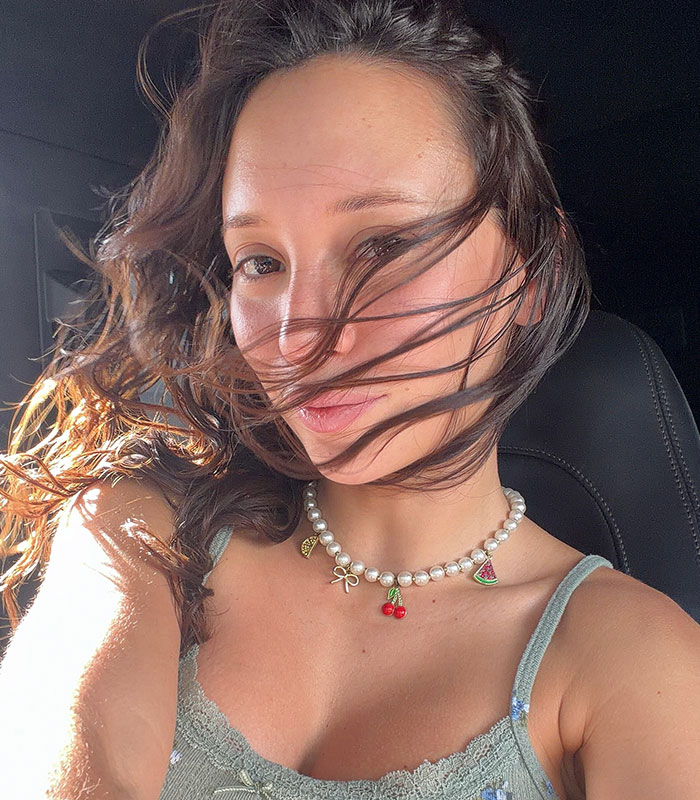 Close-up of an influencer with wind-blown hair, discussing the life-long consequences of illegal plastic surgery. Close-up of an influencer with wind-blown hair, discussing the life-long consequences of illegal plastic surgery.