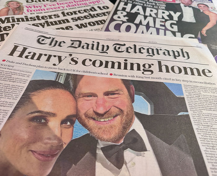 Newspapers featuring Meghan Markle and Harry, discussing their potential return to the UK amidst backlash over her acting comeback.