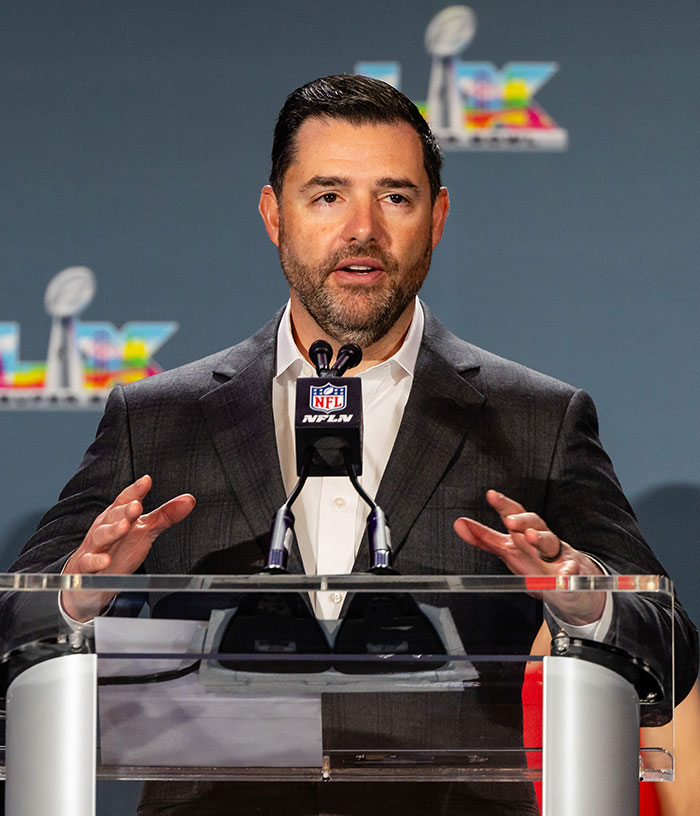 Jed York speaking at a podium, an image relevant to the 49ers owner and his public appearances.