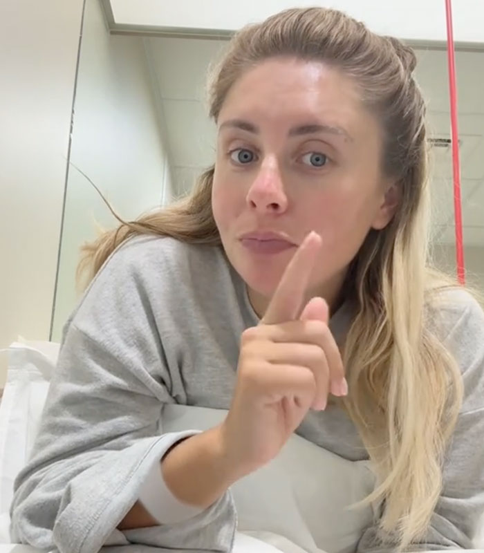 Bonnie Blue signals with her finger, emphasizing her point as she discusses giving birth to a healthy baby in the hospital. Bonnie Blue signals with her finger, emphasizing her point as she discusses giving birth to a healthy baby in the hospital.