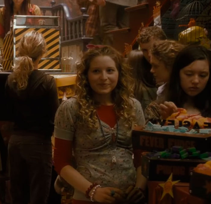 Harry Potter star Jessie Cave as a young witch, surrounded by people and magical items in a shop. Harry Potter star Jessie Cave as a young witch, surrounded by people and magical items in a shop.