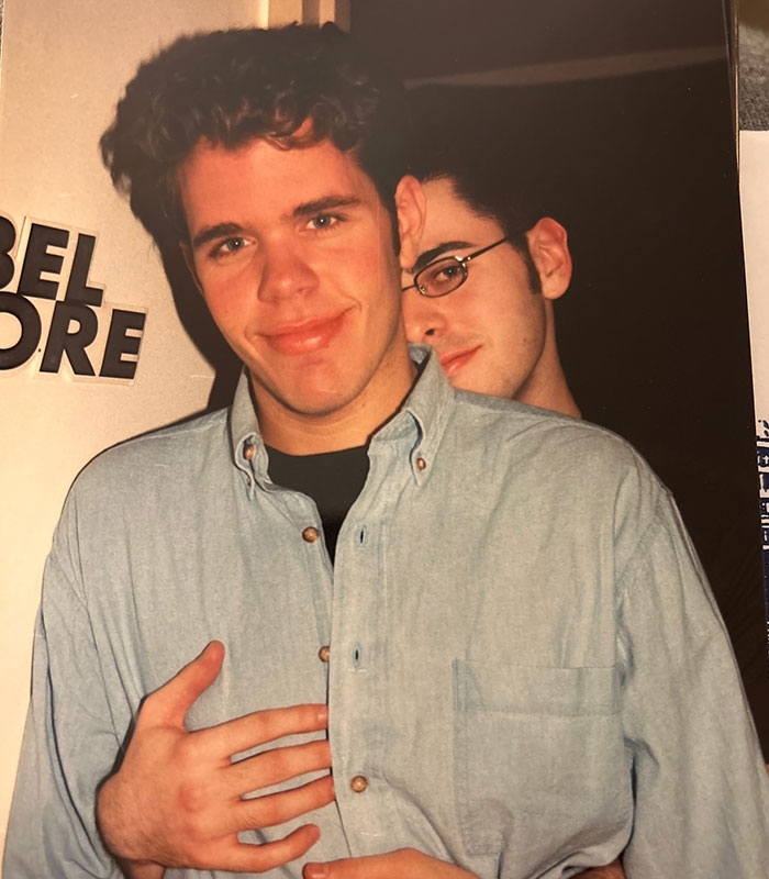 A younger Perez Hilton embracing another person, highlighting a dark childhood secret that emerged from his disturbing livestream.