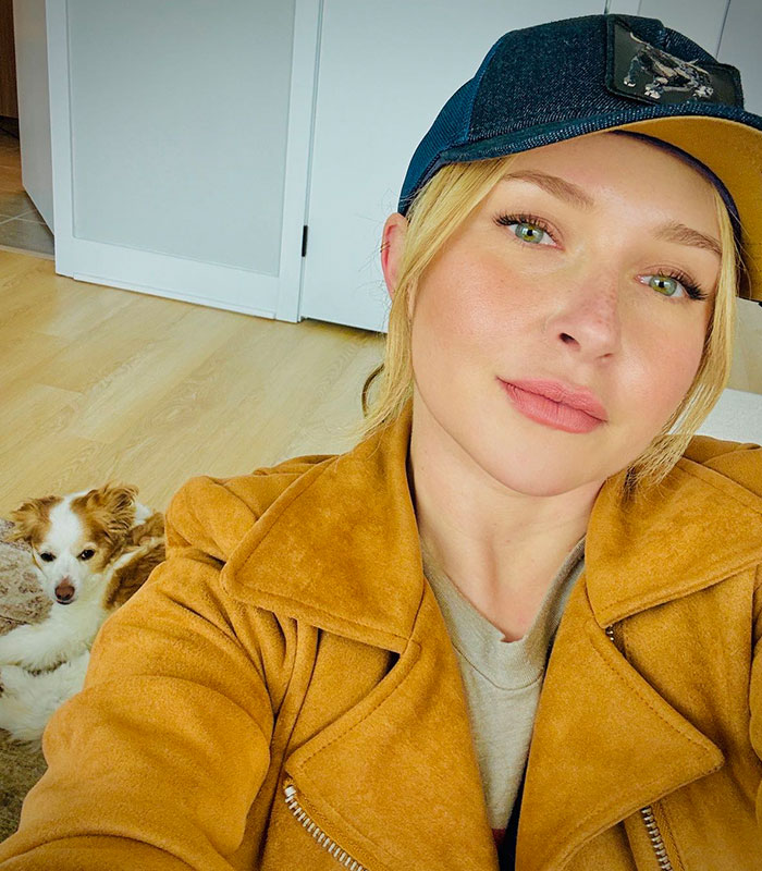 Hayden Panettiere wearing a cap and a brown jacket, with a dog beside her, relevant to autopsy results. Hayden Panettiere wearing a cap and a brown jacket, with a dog beside her, relevant to autopsy results.