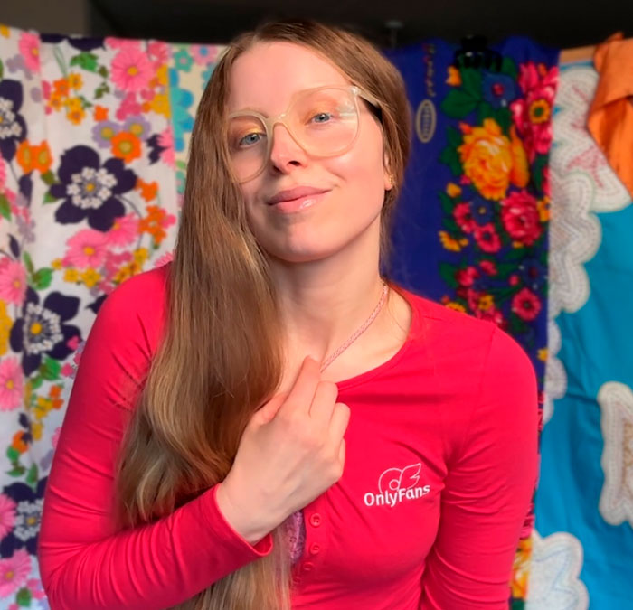 Harry Potter star Jessie Cave, now an adult creator, wears a red shirt, with a bright floral background. Harry Potter star Jessie Cave, now an adult creator, wears a red shirt, with a bright floral background.