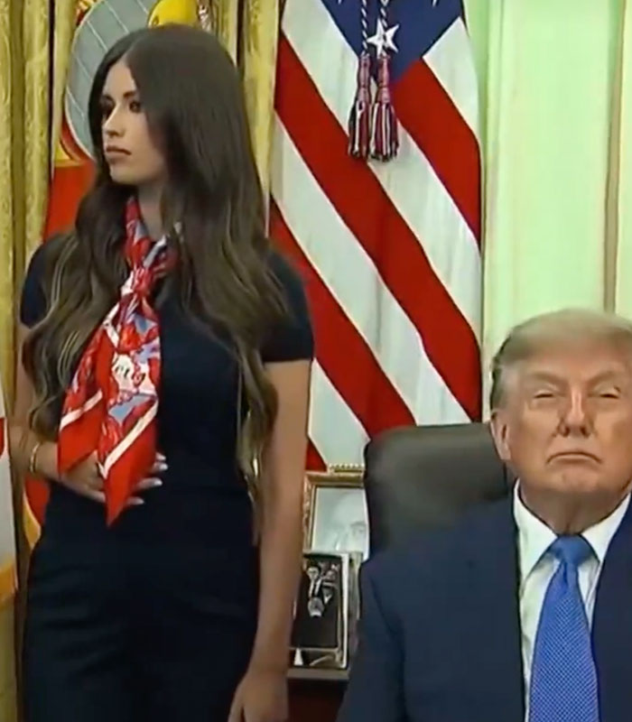 A mystery woman behind Trump with a strange gesture sparks a wild theory. A mystery woman behind Trump with a strange gesture sparks a wild theory.