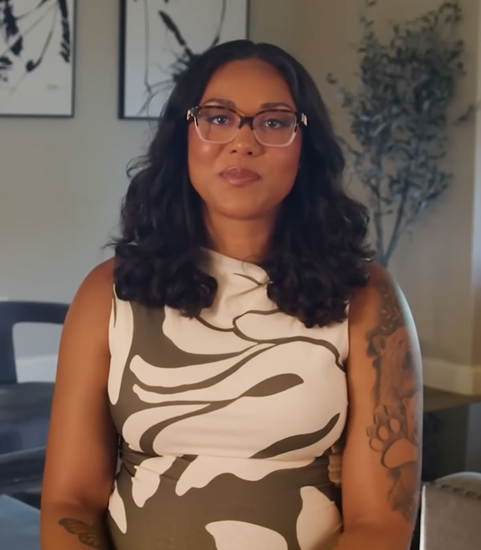 Woman in glasses, a surrogate, shares her story after giving birth and fighting parents wishes. Woman in glasses, a surrogate, shares her story after giving birth and fighting parents wishes.