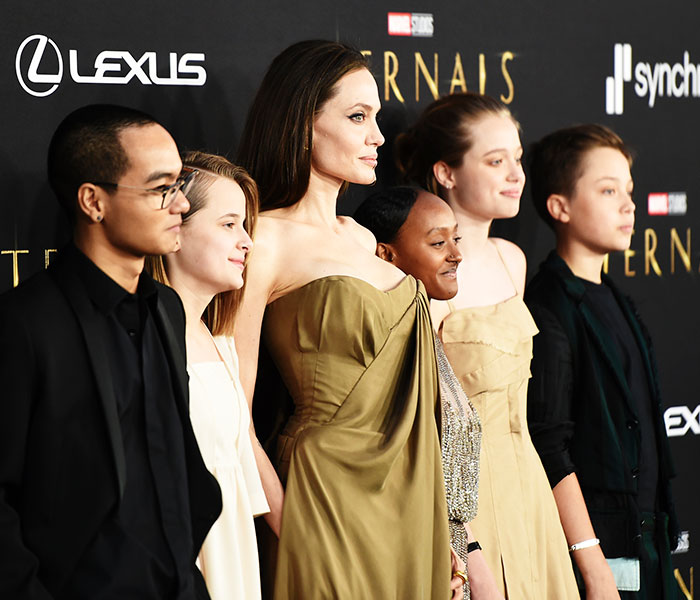 Angelina Jolie and five of her children at an event, highlighting the family's public appearances. Angelina Jolie and five of her children at an event, highlighting the family's public appearances.