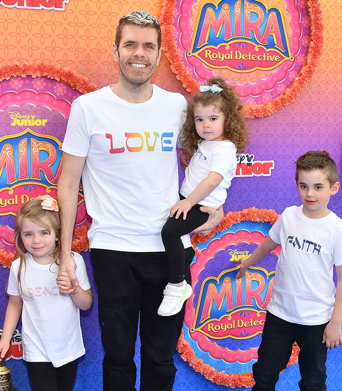 Perez Hilton with his children on a red carpet, details emerge about his recovery and permanent disfigurement. Perez Hilton with his children on a red carpet, details emerge about his recovery and permanent disfigurement.
