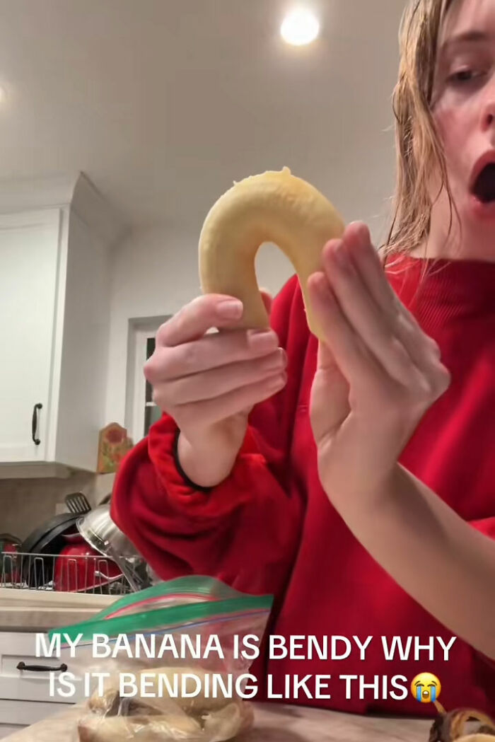 A person holding a rubbery banana that bends easily, exposing fake foods Americans eat everyday. A person holding a rubbery banana that bends easily, exposing fake foods Americans eat everyday.