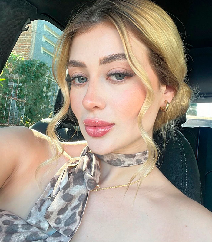 A beauty influencer with blonde hair and a leopard print top, allegedly assassinated during a livestream by a cartel boss. A beauty influencer with blonde hair and a leopard print top, allegedly assassinated during a livestream by a cartel boss.