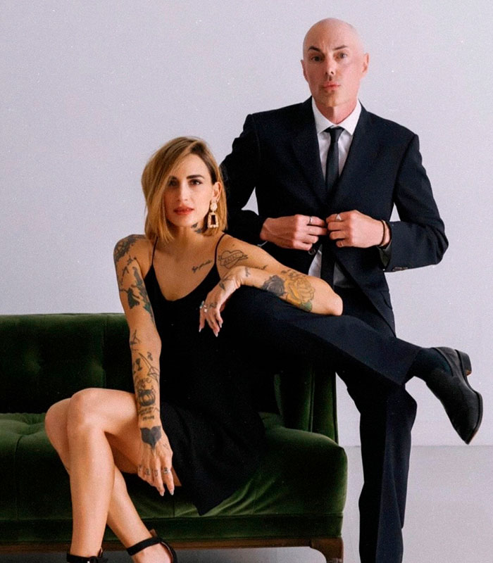 Angelina Jolie's brother and partner pose in elegant attire, making an emotional live stream appearance.