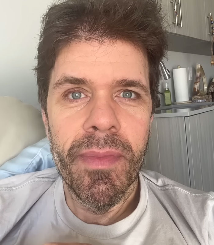 A close-up of Perez Hilton's face, hinting at the unsettling nature of his livestream and family secrets.