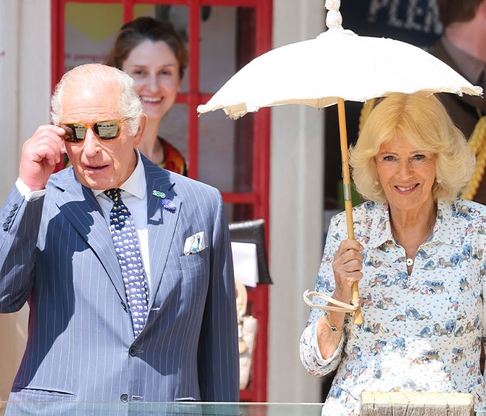King Charles and Camilla, Queen Consort, outdoor, perhaps showing a moment of calm despite family tension. King Charles and Camilla, Queen Consort, outdoor, perhaps showing a moment of calm despite family tension.