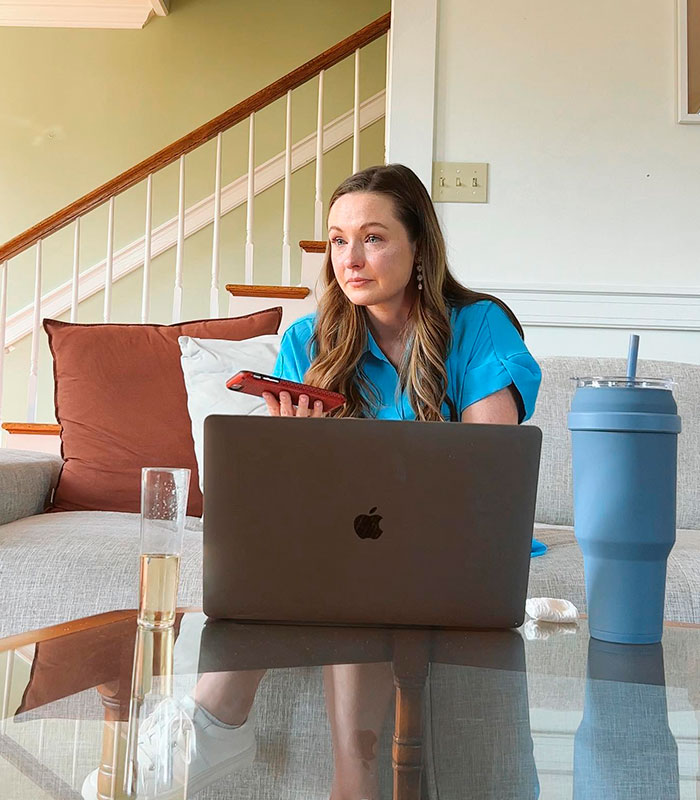 Woman looking distressed while on her laptop, after discovering her husband cheating with a private investigator. Woman looking distressed while on her laptop, after discovering her husband cheating with a private investigator.