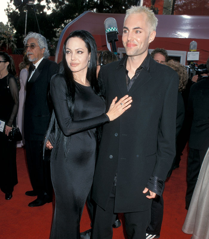 Angelina Jolie and her brother, James Haven, on a red carpet, with Angelina's hand on his chest, breaking his silence.