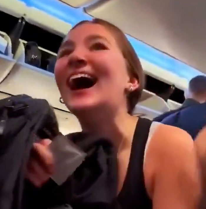 A daughter's surprise reaction to her family flying across the world to surprise her, showing pure joy.