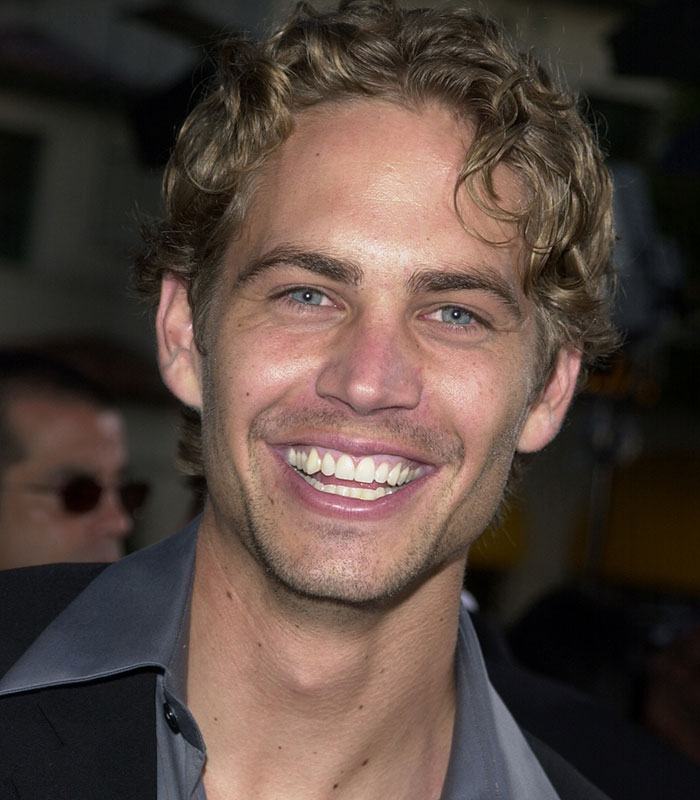 Young Paul Walker smiling, involved in controversy igniting backlash over age gap with girlfriend.