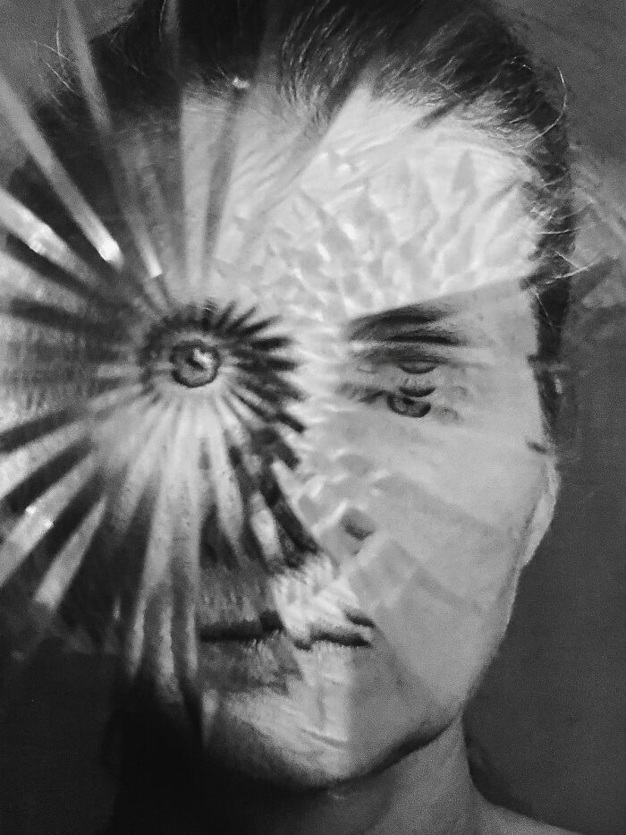 An abstract portrait with a face fragmented by shards, showcasing an extraordinary image from the Minimalist Photography Awards.