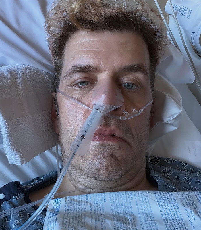 Perez Hilton looking unwell with a nasal cannula in a hospital bed, a firsthand account of his disturbing livestream.