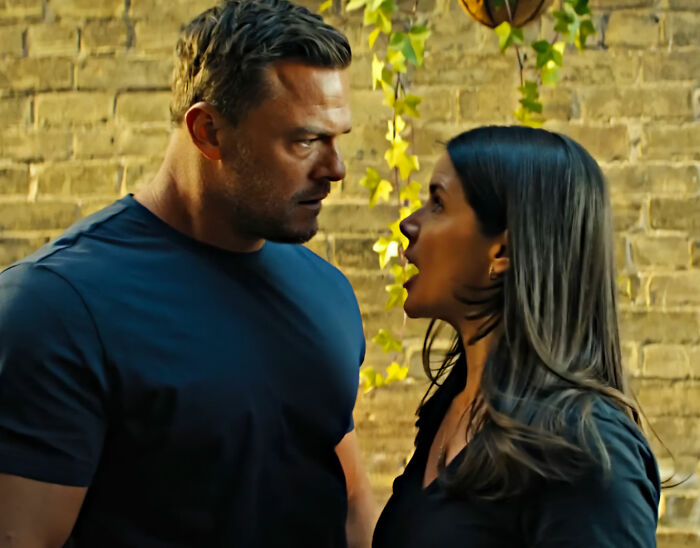 Alan Ritchson in a confrontational scene, subtly referencing his anticipated shirtless moment. Alan Ritchson in a confrontational scene, subtly referencing his anticipated shirtless moment.