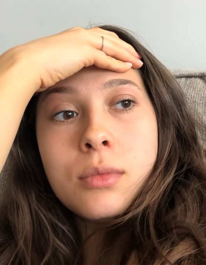 A woman looking distressed, experiencing unexplained symptoms months after moving in with her boyfriend. A woman looking distressed, experiencing unexplained symptoms months after moving in with her boyfriend.