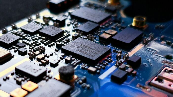 Close-up of a circuit board, highlighting its intricate components related to scientific facts.