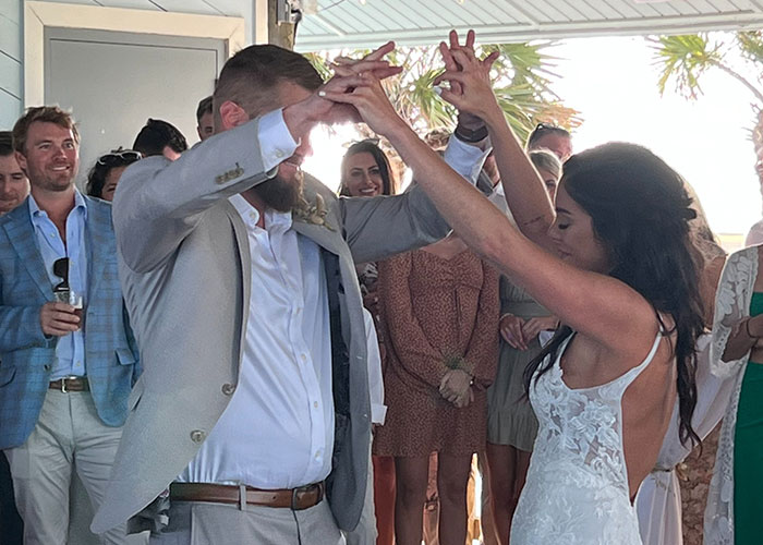 The bride and groom dancing joyfully on their wedding day, moments before the tragic event caused by a drunk woman. The bride and groom dancing joyfully on their wedding day, moments before the tragic event caused by a drunk woman.