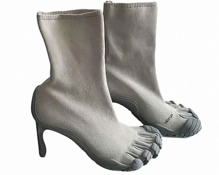 A pair of grey, high-heeled sock-like boots with separate toe compartments, considered a bad fashion crime.