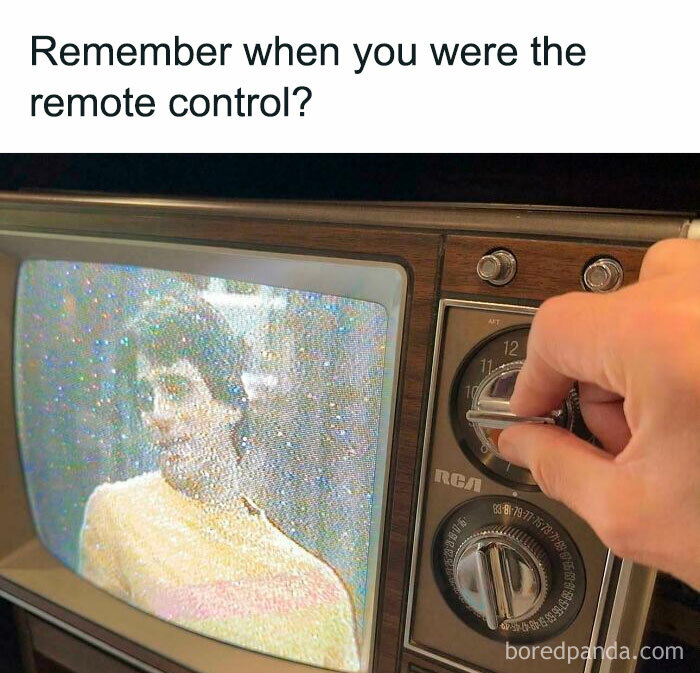 A hand adjusting a dial on an old television, a classic Gen X experience.