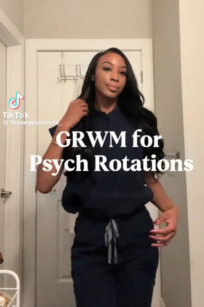 Influencer posing in scrubs, getting ready for psych rotations, showcasing her career journey. Influencer posing in scrubs, getting ready for psych rotations, showcasing her career journey.