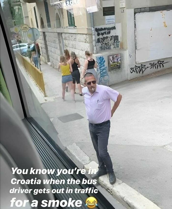 Eastern European bus driver on a smoke break in Croatia, highlighting why people are built different.
