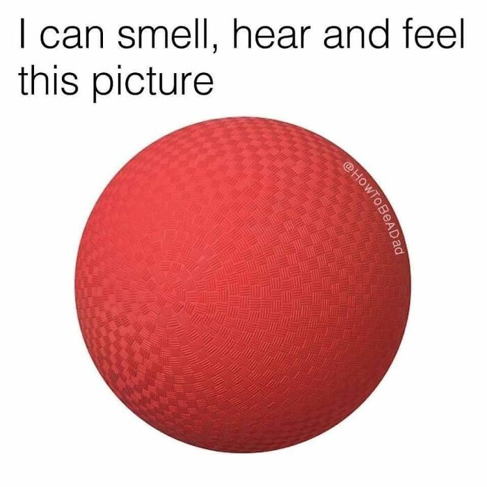 A red rubber dodgeball evoking sensory memories for Gen X, a popular childhood item.