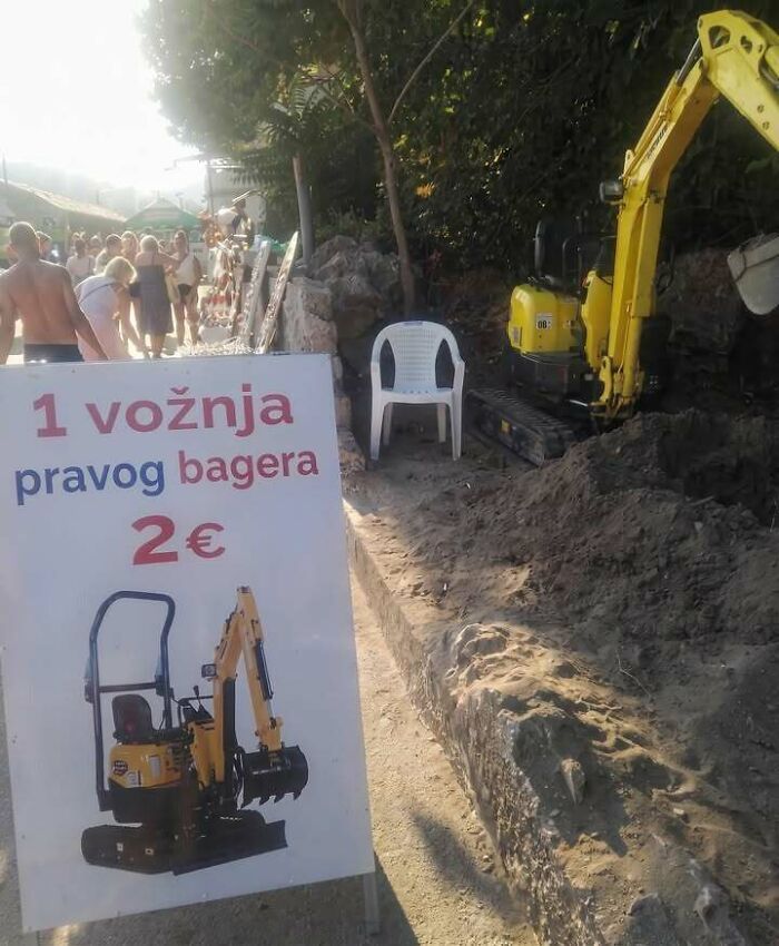 Eastern Europe meme: A sign advertising excavator rides for 2€ next to an actual excavator and a crowd of people.