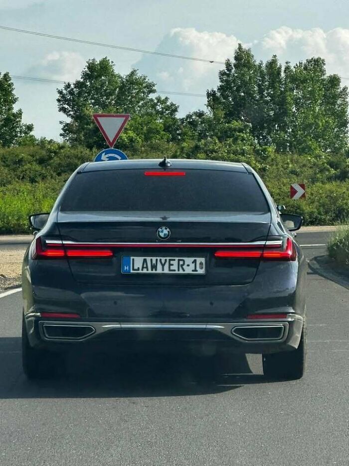 A black BMW with a custom 'LAWYER-1' license plate, showcasing that people from Eastern Europe are built different.