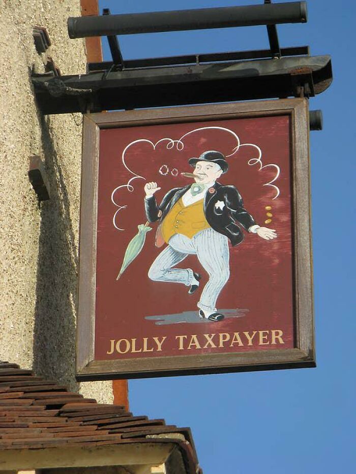 A pub sign depicting Jolly Taxpayer, embodying British humor.