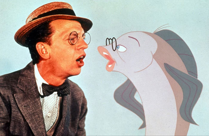 People forgot the name to something, describing a man in a hat and glasses talking to an animated fish.