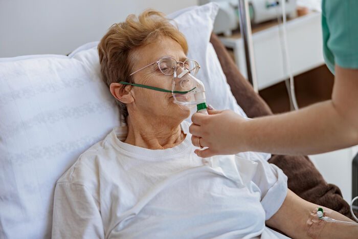 An elderly woman wearing glasses with an oxygen mask. Doctors refuse to do certain things after seeing them go wrong.