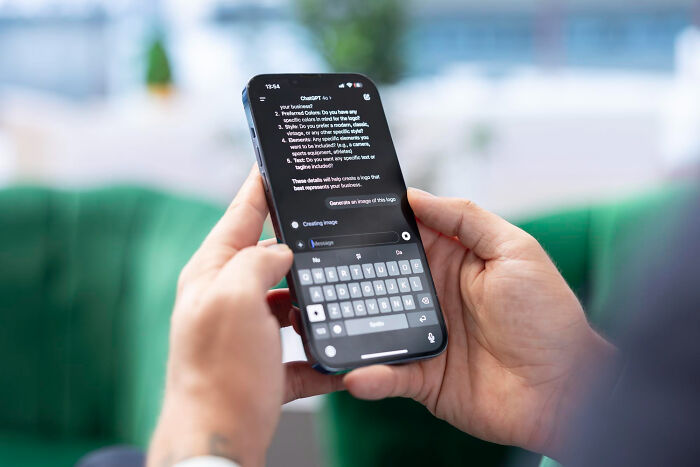 Person holding a smartphone displaying AI generated skills ideas, genuinely changed lives in 30 days.