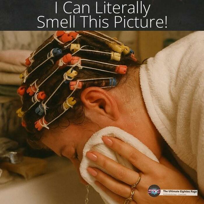 A person with colorful hair curlers and a towel, evoking a sensory memory of the 80s and how old you become.
