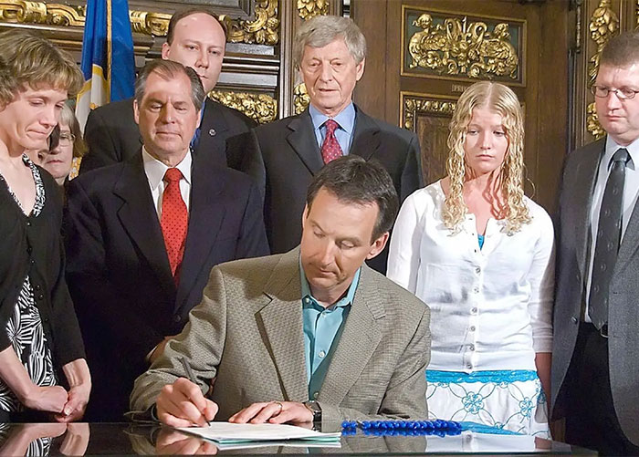 Brandon Swanson's family and officials at a press conference regarding the car crash and disappearance.