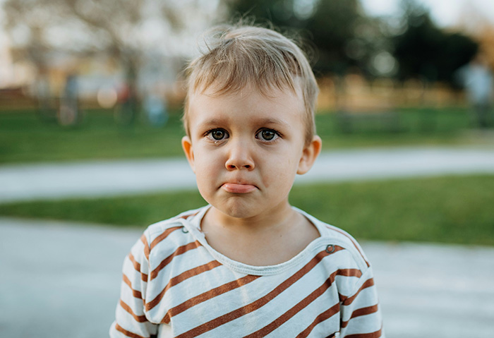 A sad child, symbolizing a daughter suffering from her mothers actions. A sad child, symbolizing a daughter suffering from her mothers actions.